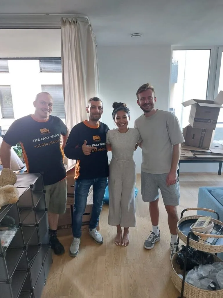 Family with movers after successful move in Essen